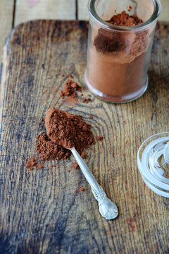 Cocoa Powder On A Spoon In A Jar