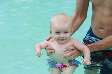 Adorable baby enjoying her swim