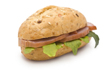 Sandwich with Ham and Arugula isolated on white