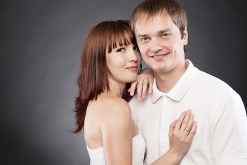 Сlose-up  portrait of beautiful loving couple posing in a studi