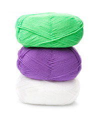 stack of yarn skeins in green, purple, white colors on white bac