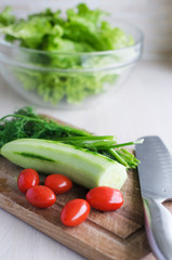 The veggies on the cutting board