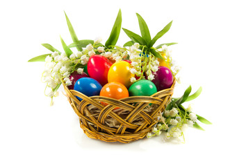easter eggs in busket on green gras isolated concept holyday
