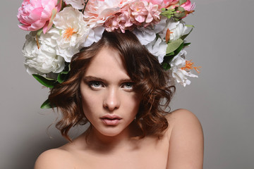 fashion model with large hairstyle and flowers in her hair
