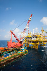 Fototapeta na wymiar Large crane vessel installing the platform in offshore