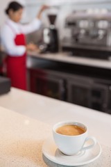 Cup of coffee on a counter