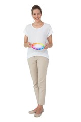 Full length of a young woman with paint samples