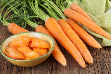 Fresh Carrots on a wooden background