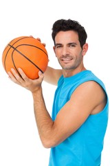 Obraz premium Portrait of a basketball player with ball
