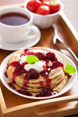 pancakes with cherry jam and cream for breakfast