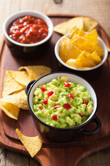 guacamole with avocado, lime, chili and tortilla chips, salsa