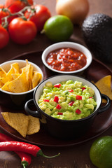 guacamole with avocado, lime, chili and tortilla chips, salsa