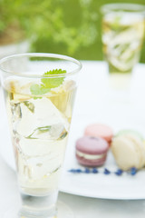 Iced herb tea and colorful macaroon