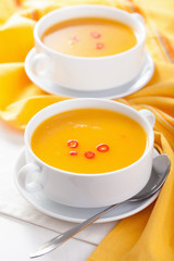 pumpkin soup in white bowl
