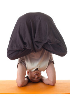 Yoga Headstand Posing By Middle Aged Man