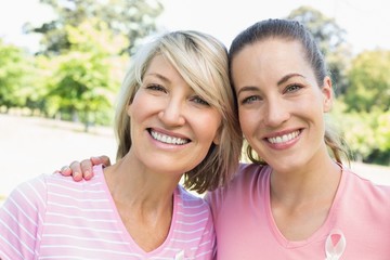Female volunteers participating in breast cancer awareness