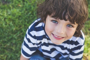 Close-up of a cute boy smiling at park