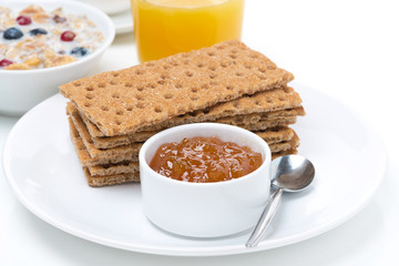 breakfast - crisp bread with jam, orange juice and muesli