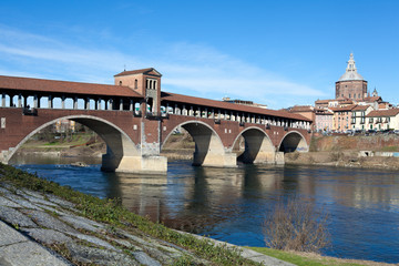 Old bridge over Ticino river in Pavia, Italy