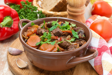 Stew with beef, prunes, vegetables and parsley