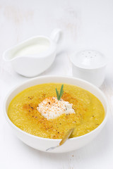 vegetable soup with cream and rosemary, vertical