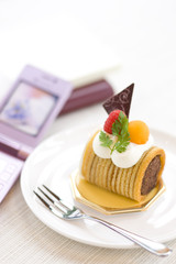 Cake on a table and mobile phone 