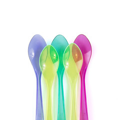 color plastic spoons isolated