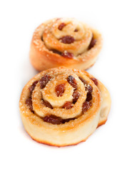Two swirl buns with raisins and brown sugar