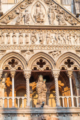 Ferrara, ITALY -  Part of facade of Cathedral sculpture