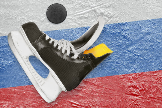Puck, skates and the Russian flag