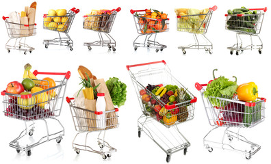 Trolleys with different products isolated on white