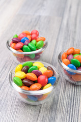 Three glass bowls with crunchy sweeties