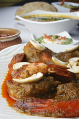 Narkel chingri is a prawn dish 