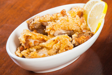 a bowl of lemon chicken
