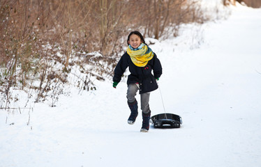 Fototapeta na wymiar Girl sledging