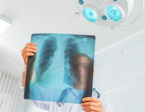 Doctor looks at x-ray image