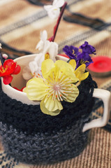 bright spring flowers in the crooked mouth and bandaged bowl