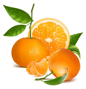 Fresh tangerines with green leaves and orange.