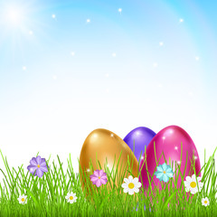 Three multicolored eggs in grass with flowers