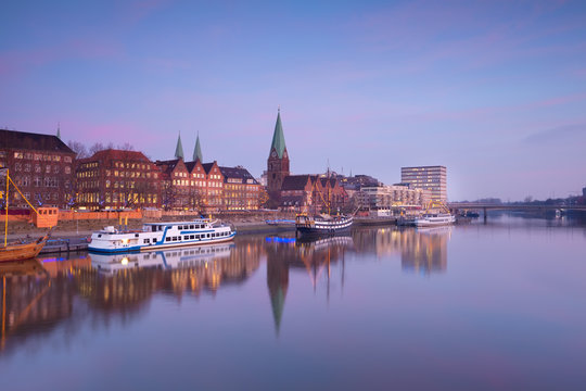 Bremen city by river at sunset