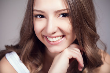 Portrait of beautiful woman over gray background