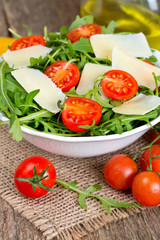 fresh salad from rucola, cherry tomatoes and parmesan cheese