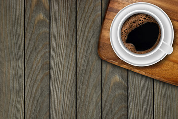 Cup of coffee on wooden background