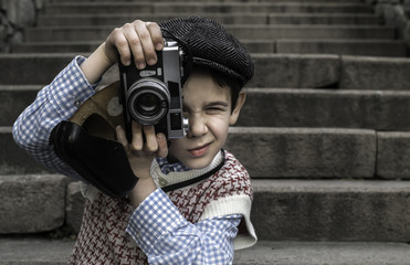 Child with vintage camera