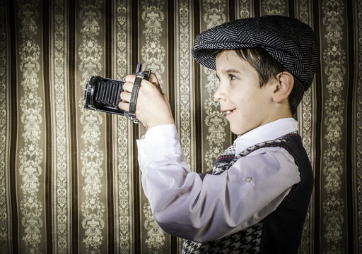 Child taking pictures with vintage camera