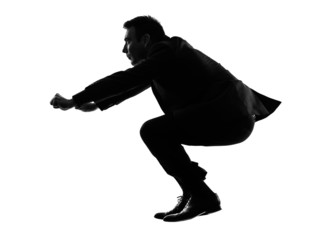 business man driving imaginary motorcycle silhouette