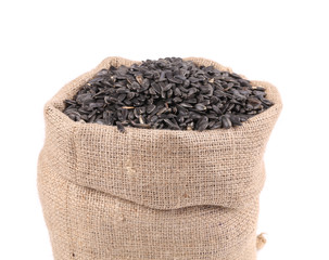 Close up of black sunflower seeds in bag.