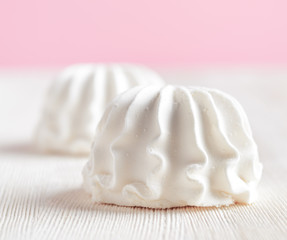 Fototapeta na wymiar White marshmallow on wooden table