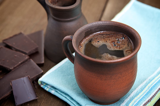 Coffee in a brown ceramic cup
