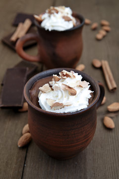 Hot chocolate with whipped cream and almonds